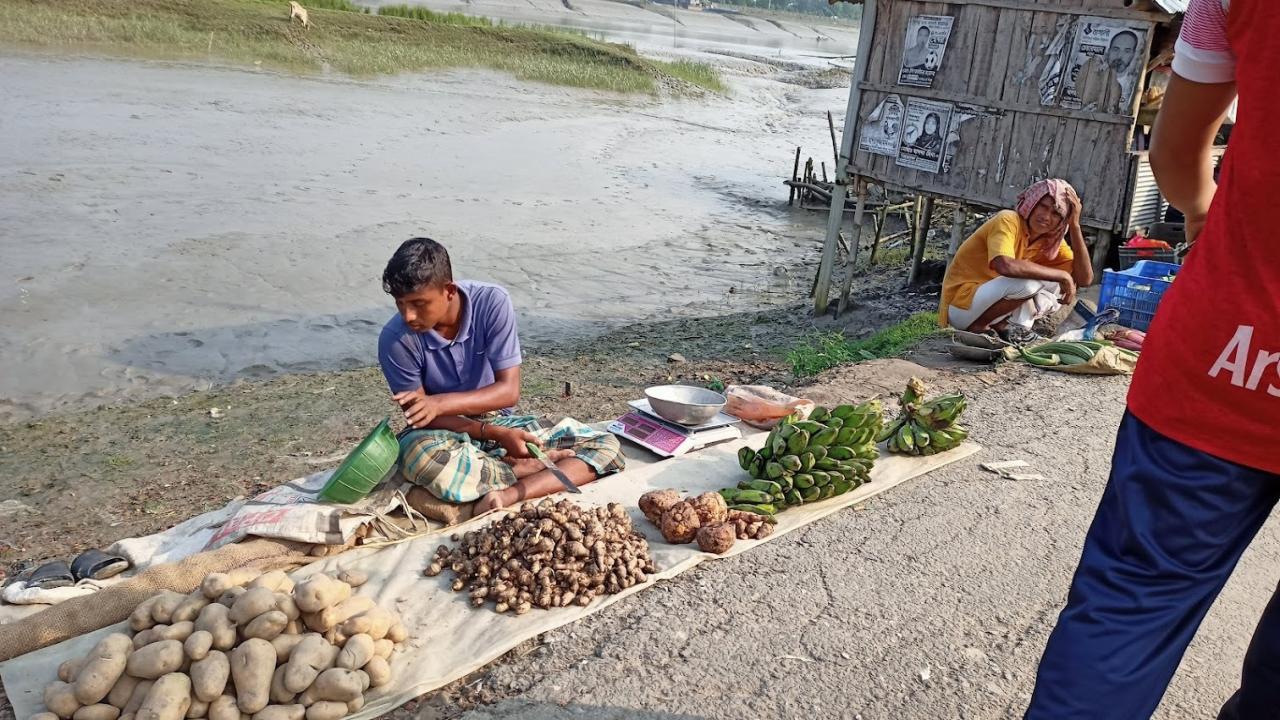a_vegetable_sellers_in_the_weekly_village_hat_in_a_sundarbans_adjacent_areao_of_gabura_union_in_satkhira.jpeg